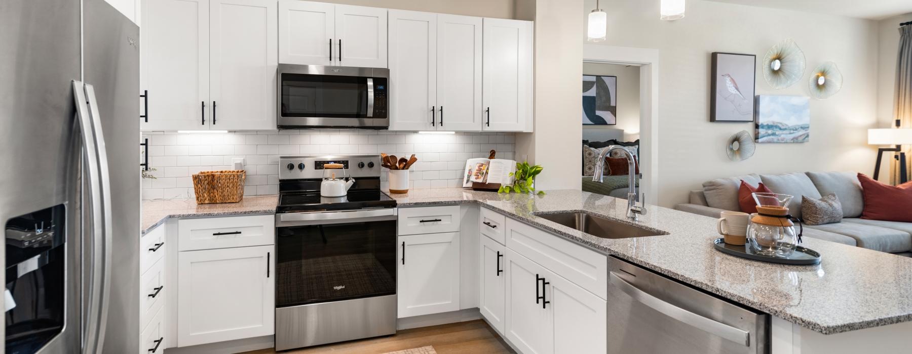 a kitchen with white cabinets