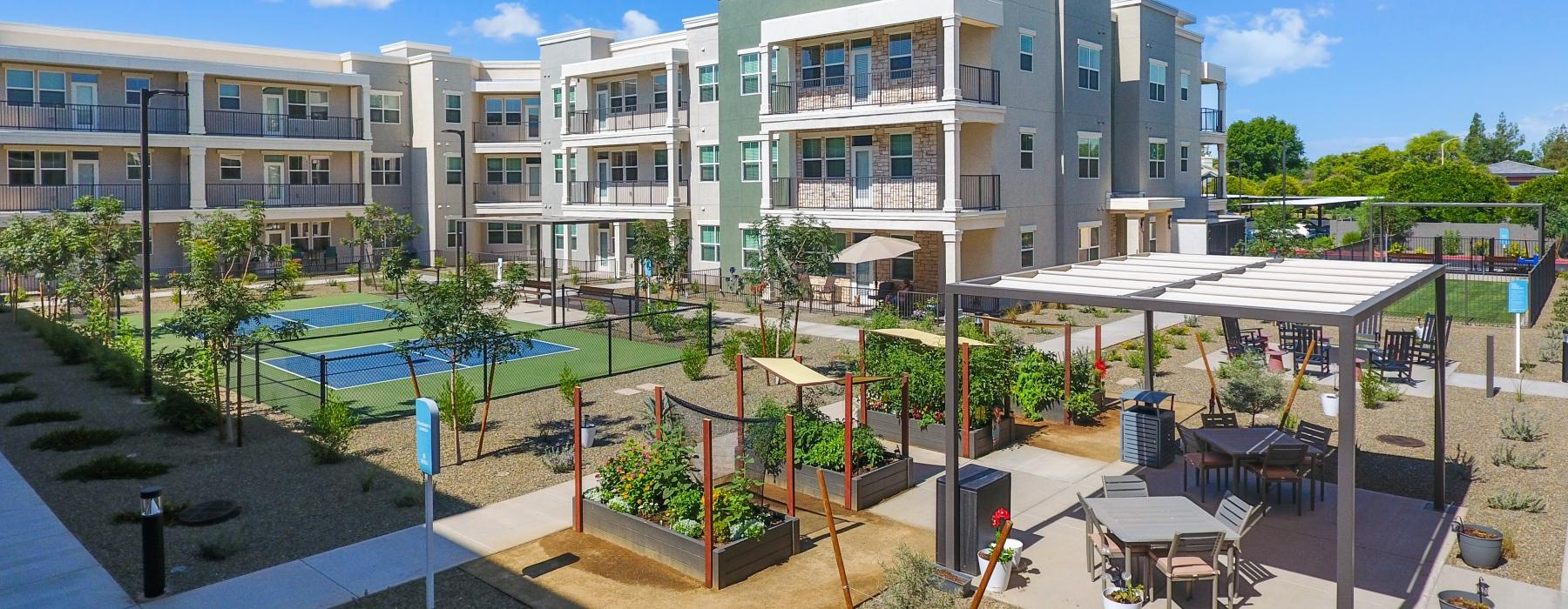 a building with tables and chairs outside
