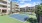 a tennis court in front of a building