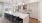 a kitchen with white cabinets