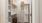 a closet with robes and shelving